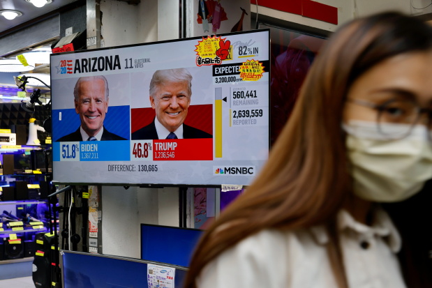 a news report of the u s presidential election is seen on television screen in hong kong china november 4 2020 reuters