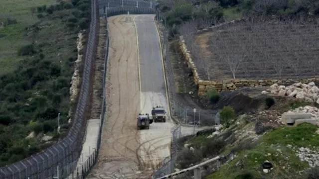 the fence separating the israeli annexed golan heights from syria is patrolled by israeli military vehicles photo afp the fence separating the israeli annexed golan heights from syria is patrolled by israeli military vehicles photo afp