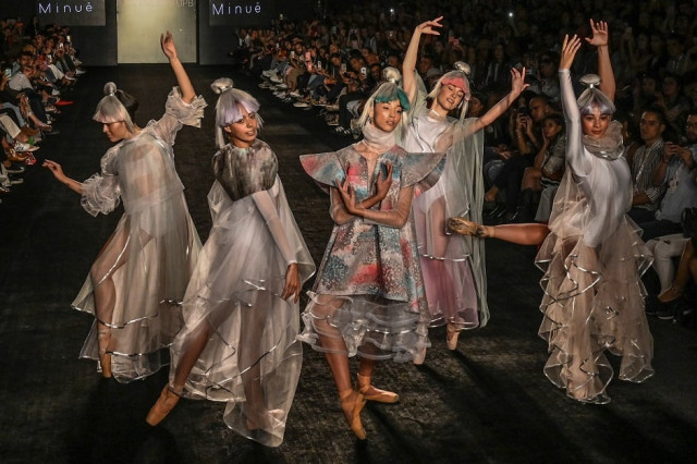 models present creations by fashion design students from the pontificia bolivariana university photo afp
