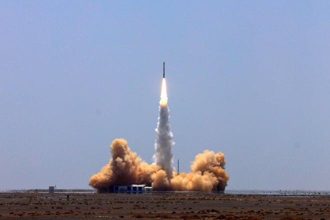 a rocket carrying two satellites lifts off from the jiuquan satellite launch centre in gansu province photo afp