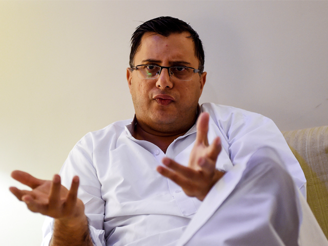 pakistani police officer and crime stories writer omar shahid hamid gestures as he speaks during an interview with afp in karachi   personal tragedy haunts the hard boiled novels that are turning top cop omar shahid hamid into one of pakistan 039 s most popular english language authors