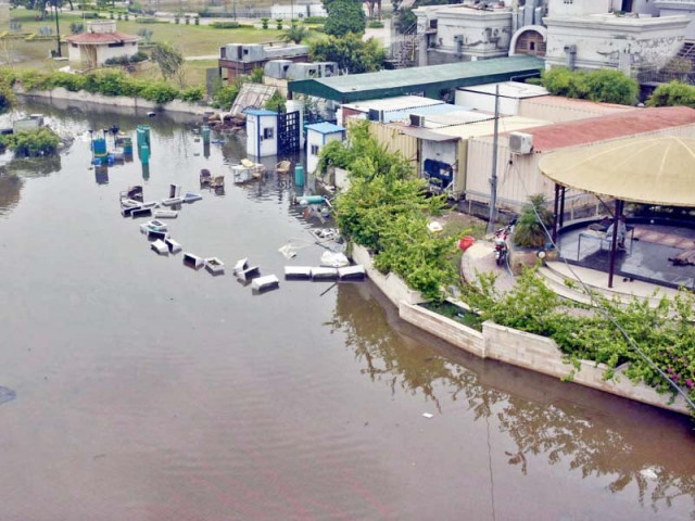 rainwater accumulates in the family area of the greater iqbal park after heavy rains photo online rainwater accumulates in the family area of the greater iqbal park after heavy rains photo online