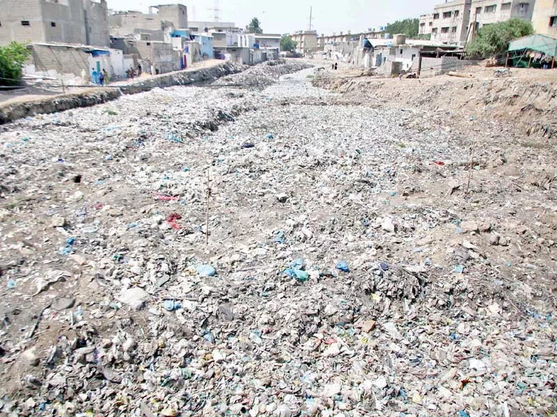several of karachi s drains remain clogged despite efforts initiated supposedly in time for the monsoon the accumulation of waste dumped by citizens govt and private institutions is causing the storm water drains to choke all over the city says one kmc official photos nni several of karachi s drains remain clogged despite efforts initiated supposedly in time for the monsoon the accumulation of waste dumped by citizens govt and private institutions is causing the storm water drains to choke all over the city says one kmc official photos nni
