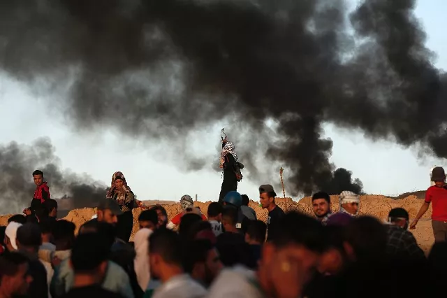 palestinian protesters burn tyres during a demonstration on the beach near the maritime border with israel in beit lahia in the northern gaza strip on october 29 2018 photo afp palestinian protesters burn tyres during a demonstration on the beach near the maritime border with israel in beit lahia in the northern gaza strip on october 29 2018 photo afp