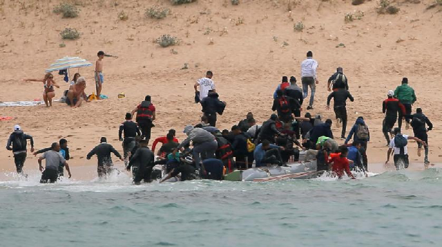 migrants at quot del canuelo quot beach after they crossed the strait of gibraltar sailing from the coast of morocco photo reuters