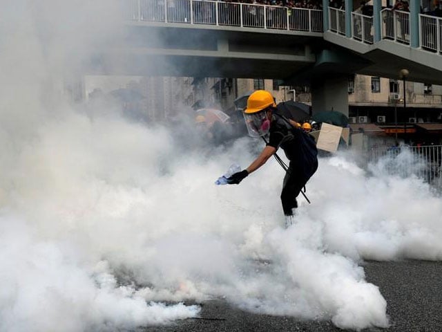 a demonstrator reacts to a tear gas during a protest against the yuen long attacks in yuen long new territories hong kong china july 27 2019 photo reuters