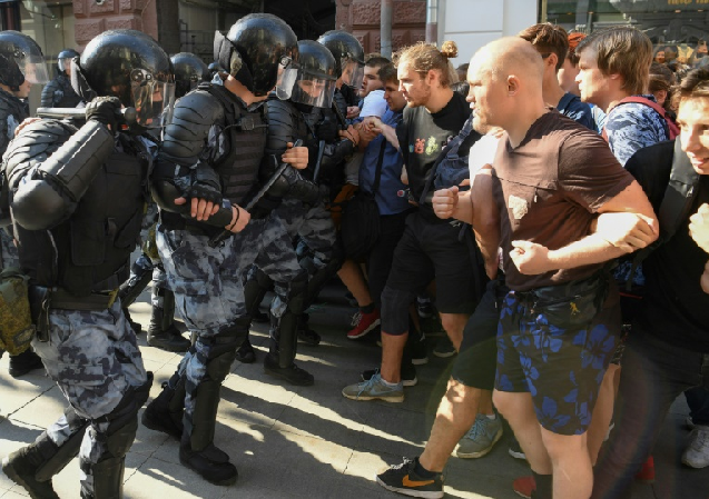 police and protesters face off at a demonstration in moscow photo afp