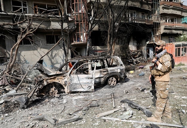 an afghan security force personnel inspects the site of sunday s attack in kabul photo reuters