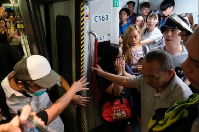 activists blocked train doors playing havoc with services and forcing hundreds of people to stream out of railway stations in search of alternative transport photo reuters activists blocked train doors playing havoc with services and forcing hundreds of people to stream out of railway stations in search of alternative transport photo reuters