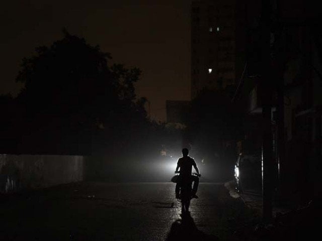 many areas plunge into darkness after k electric suspends supply from kda grid station photo afp file