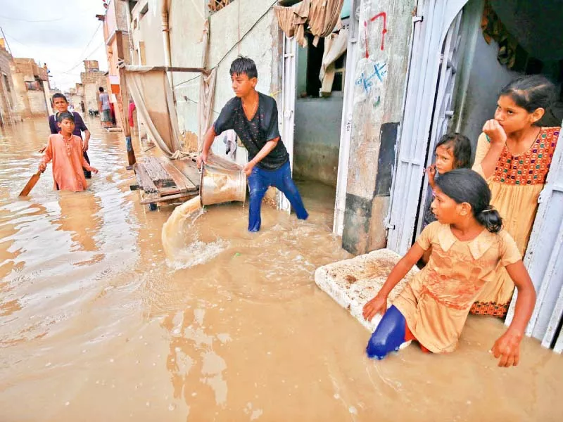 as the downpour continued in karachi for the second consecutive day the city remained on a standstill with citizens finding it difficult to carry out their routine chores photos inp as the downpour continued in karachi for the second consecutive day the city remained on a standstill with citizens finding it difficult to carry out their routine chores photos inp