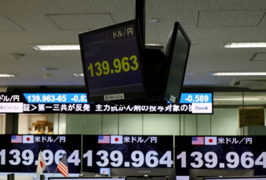 monitors displaying the current japanese yen exchange rate against the u s dollar are pictured at a dealing room of the foreign exchange trading company gaitame com in tokyo japan photo reuters