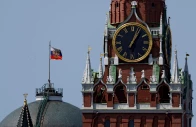 the russian flag flies on the dome of the kremlin senate building behind spasskaya tower in moscow russia photo reuters