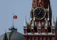 the russian flag flies on the dome of the kremlin senate building behind spasskaya tower in moscow russia photo reuters