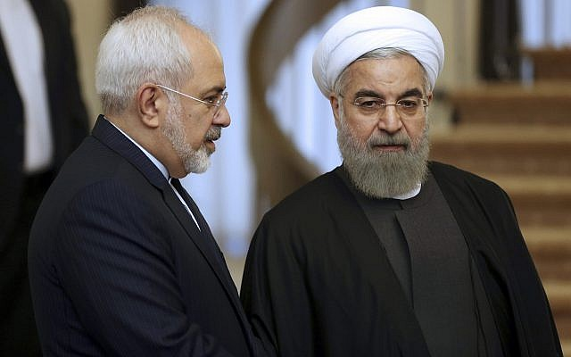 in this photo from november 24 2015 iranian president hassan rouhani listens to his foreign minister mohammad javad zarif prior to a meeting in tehran iran photo afp