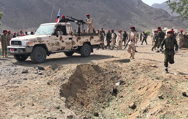 yemeni security forces gather at the scene of a missile attack on a military camp west of yemen 039 s government held second city aden on august 1 2019 photo afp