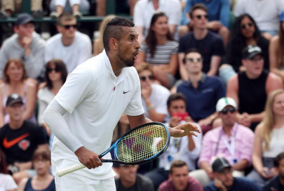 fiery kyrgios advances tsitsipas survives in washington