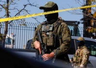 border patrol officer stands behind tape during demonstrators standoff with us immigration and customs enforcement ice and federal officers in the little village neighborhood of chicago illinois us october 4 2025 photo reuters