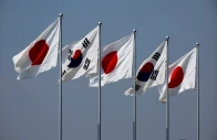 a view of south korean and japanese national flags hoisted ahead of the arrival of south korea s president yoon suk yeol and his wife kim keon hee at tokyo international airport photo reuters