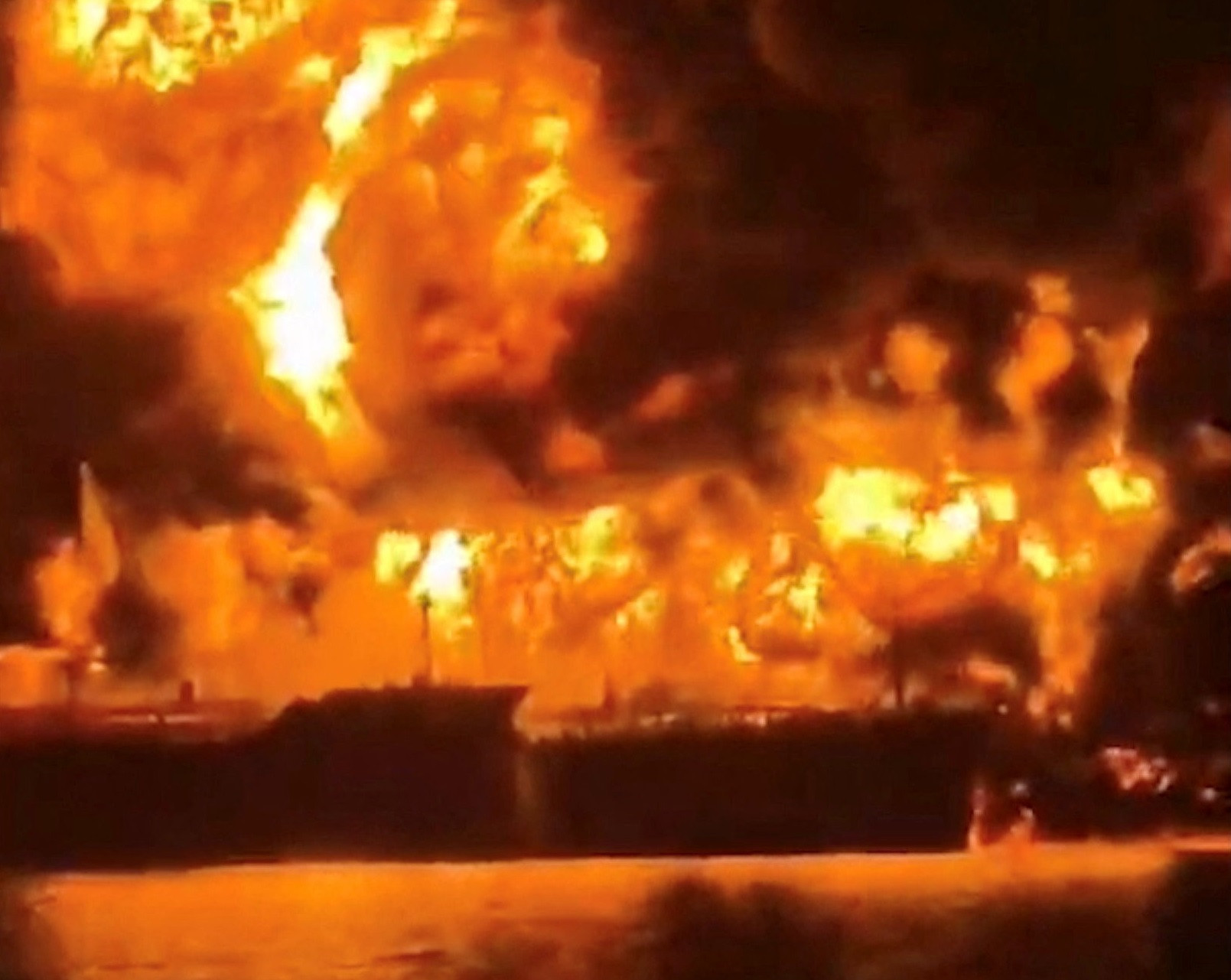 A ship burns, after Iranian explosive-laden boats appear to have attacked two fuel tankers in Iraqi waters setting them ablaze, according to port, maritime security and risk firms, amid the U.S.-Israeli conflict with Iran, in this screengrab taken from a handout video released March 12, 2026. PHOTO: REUTERS