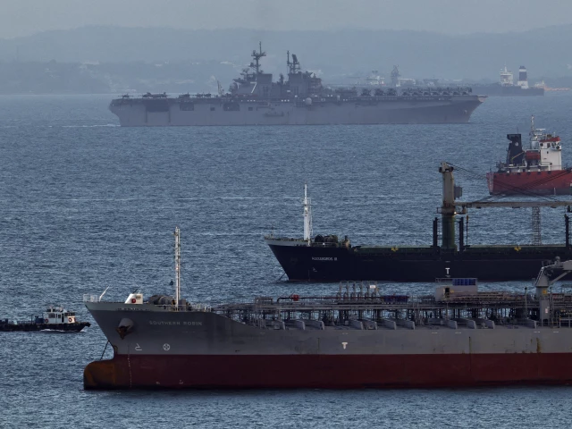 the uss tripoli lha 7 amphibious assault ship enters the singapore strait amid the u s israeli conflict with iran as seen from singapore march 17 2026 photo reuters the uss tripoli lha 7 amphibious assault ship enters the singapore strait amid the u s israeli conflict with iran as seen from singapore march 17 2026 photo reuters