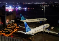 grounded aircraft operated by united airlines as a damaged air canada express jet and a ground vehicle that collided are seen in the background at la guardia airport in queens new york u s march 23 2026 photo reuters