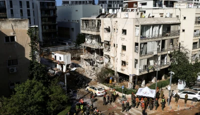 emergency personnel work at the site following iranian missile barrages in central israel amid the u s  israel conflict with iran in tel aviv israel march 24 2026 photo reuters