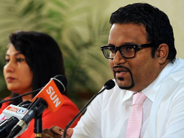 in this photograph taken on november 11 2013 former maldives tourism minister and deputy leader ahmed adeeb r speaks while maldives acting minister for foreign affairs mariyam shakeela looks on during a press conference in male photo afp