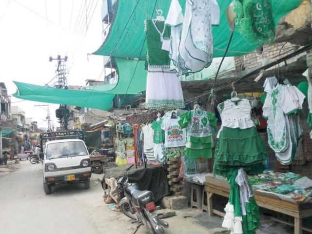 shopkeepers sell national flag themed dresses at a market in rawalpindi photo agha mehroz express shopkeepers sell national flag themed dresses at a market in rawalpindi photo agha mehroz express