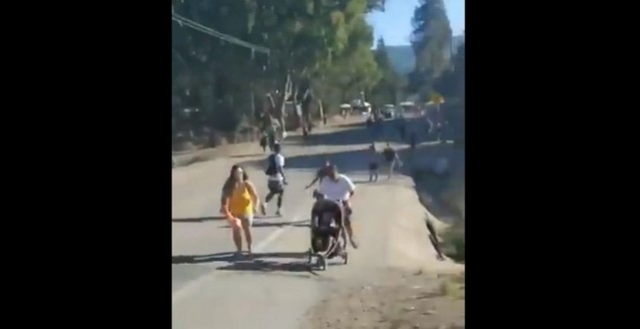 a screengrab of a video showing people running away from the gunshots photo afp a screengrab of a video showing people running away from the gunshots photo afp