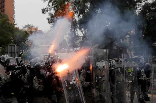 police officers fire tear gas at demonstrators during a protest against the yuen long attacks in yuen long photo reuters police officers fire tear gas at demonstrators during a protest against the yuen long attacks in yuen long photo reuters