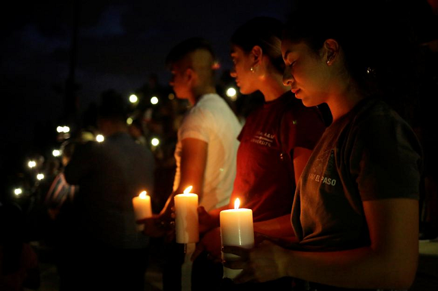 mourners taking part in a vigil at el paso high school after a mass shooting at a walmart store in el paso texas us august 3 2019 photo reuters mourners taking part in a vigil at el paso high school after a mass shooting at a walmart store in el paso texas us august 3 2019 photo reuters