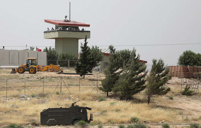 turkish soldiers stand on a watch tower at the atmeh crossing on the syrian turkish border as seen from the syrian side in idlib governorate syria may 31 2019 photo reuters turkish soldiers stand on a watch tower at the atmeh crossing on the syrian turkish border as seen from the syrian side in idlib governorate syria may 31 2019 photo reuters