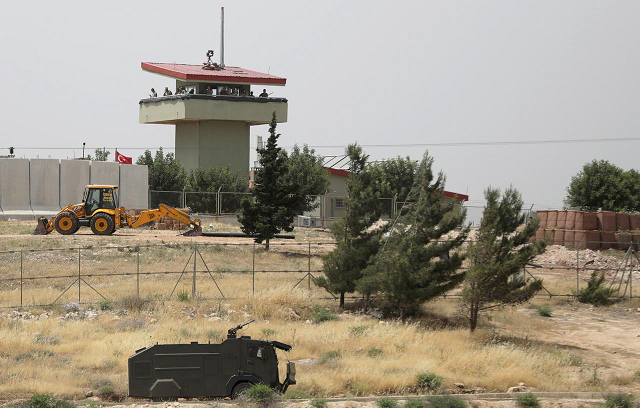 turkish soldiers stand on a watch tower at the atmeh crossing on the syrian turkish border as seen from the syrian side in idlib governorate syria may 31 2019 photo reuters