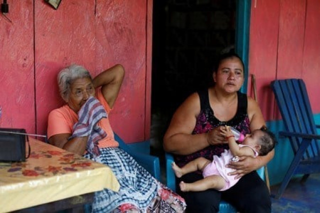 dolores morales lopez grandmother of guatemalan migrant ledy perez who was recently captured on camera by a reuters photographer pleading to mexico 039 s national guard to let her cross into the united states along her son anthony sits next to her granddaughter lolinda and great granddaughter marisol as pictured at her home in the community of santa amelia in la libertad municipality guatemala photo reuters dolores morales lopez grandmother of guatemalan migrant ledy perez who was recently captured on camera by a reuters photographer pleading to mexico 039 s national guard to let her cross into the united states along her son anthony sits next to her granddaughter lolinda and great granddaughter marisol as pictured at her home in the community of santa amelia in la libertad municipality guatemala photo reuters