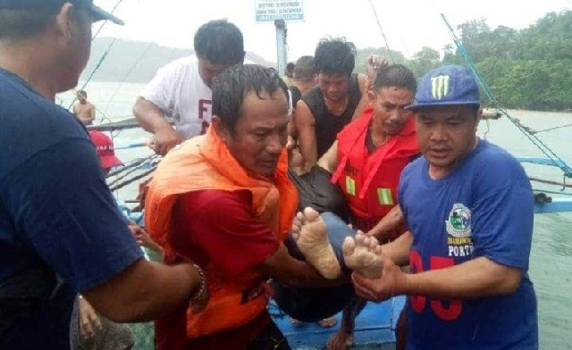 this photo shows people rescuing a person after the boat accident photo afp