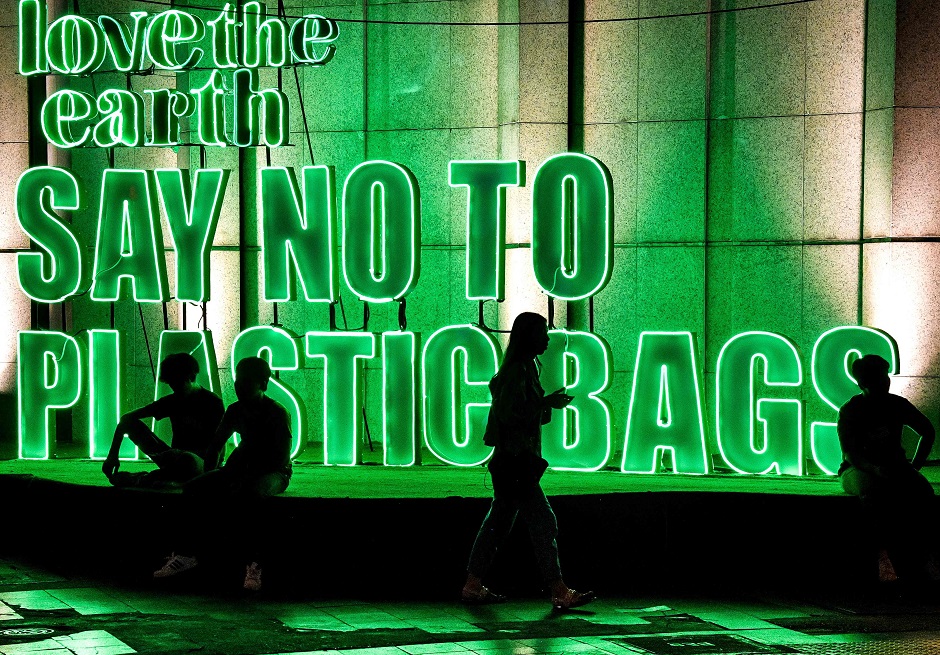 this photograph shows a publicity sign promoting a plastic bag free shopping experience outside a department store in downtown bangkok photo afp