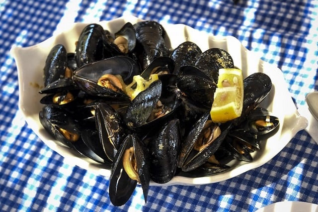 a plate of mussels at the mussel house restaurant near butrint lake south albania due to global warming the temperatures in the salted lake have been rising damaging their habitat and significantly lowering their numbers photo afp a plate of mussels at the mussel house restaurant near butrint lake south albania due to global warming the temperatures in the salted lake have been rising damaging their habitat and significantly lowering their numbers photo afp