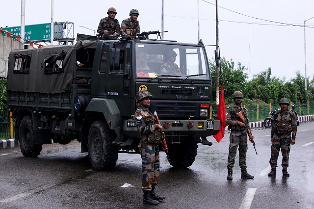 indian security personnel stand guard on a street in occupied jammu  afp