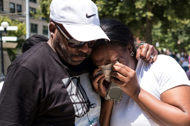 a couple mourn at a vigil for victims of the shooting in dayton ohio which killed nine people 13 hours after another gunman in el paso texas murdered 29 people photo afp