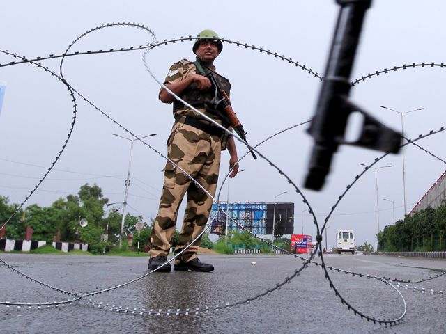 an indian soldier stands guard in occupied jammu and kashmir on august 7 photo afp