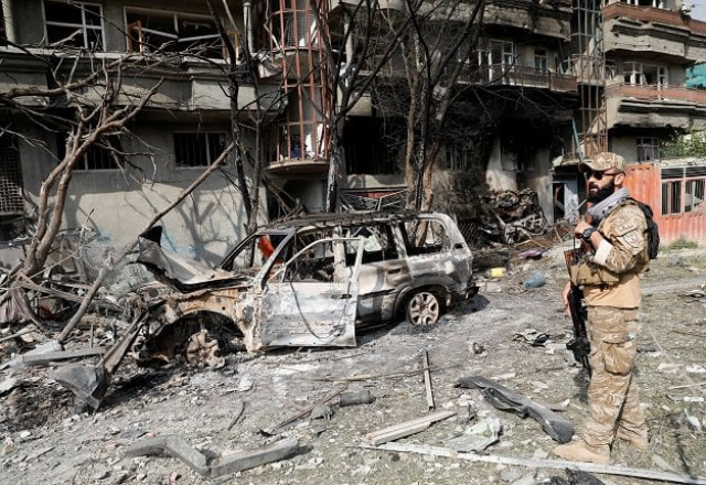 an afghan security force personnel inspects the site of an attack in kabul photo reuters an afghan security force personnel inspects the site of an attack in kabul photo reuters
