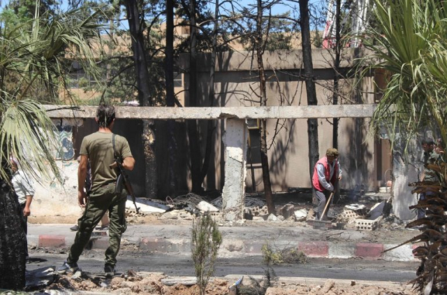 a member of the kurdish security stands guard at the site of an explosive rigged vehicle that detonated in the town of al qahtaniyah in the hasakeh province on august 7 2019 photo afp a member of the kurdish security stands guard at the site of an explosive rigged vehicle that detonated in the town of al qahtaniyah in the hasakeh province on august 7 2019 photo afp