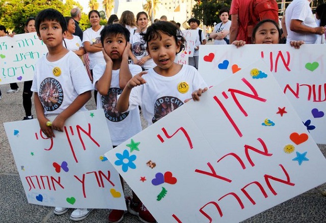 filipino children carry a banner which reads in hebrew quot we don 039 t have another country quot during a protest against deportation in tel aviv photo afp