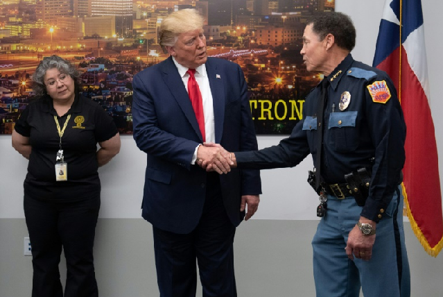 us president donald trump shakes hands with el paso police chief greg allen photo afp