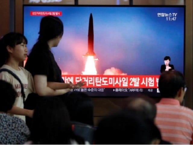 people watch a tv that shows a file picture of a north korean missile for a news report on north korea firing short range ballistic missiles in seoul south korea july 31 2019 photo reuters