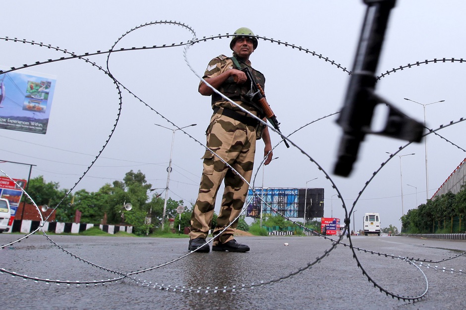 a security personnel stands guard at a roadblock in jammu photo afp