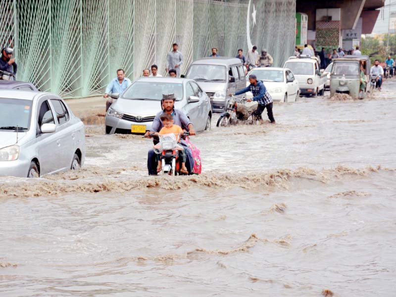 commuters in karachi faced difficulties on saturday as rainwater submerged roads and streets in various areas photo ppi