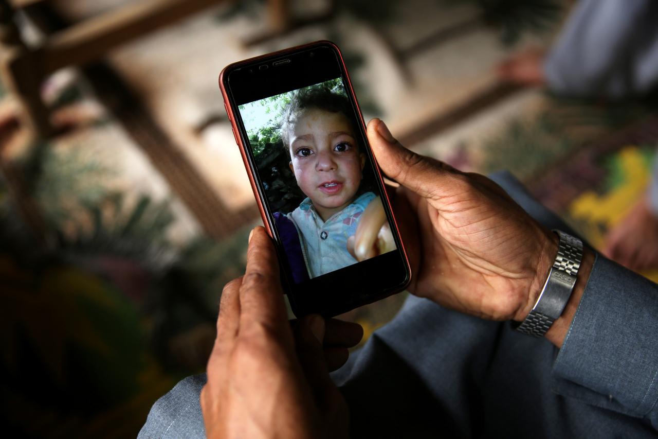 relative displays picture of 4 year old mohammad ayan ali who found a device that looked like a toy and exploded in his hands at home photo reuters