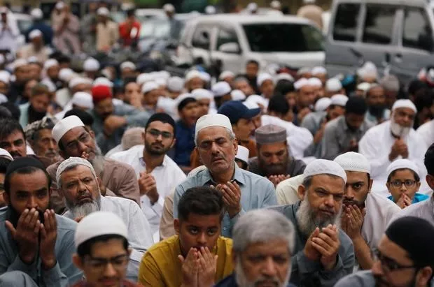 men attend eidul azha prayers outside a mosque along a street in karachi photo reuters men attend eidul azha prayers outside a mosque along a street in karachi photo reuters
